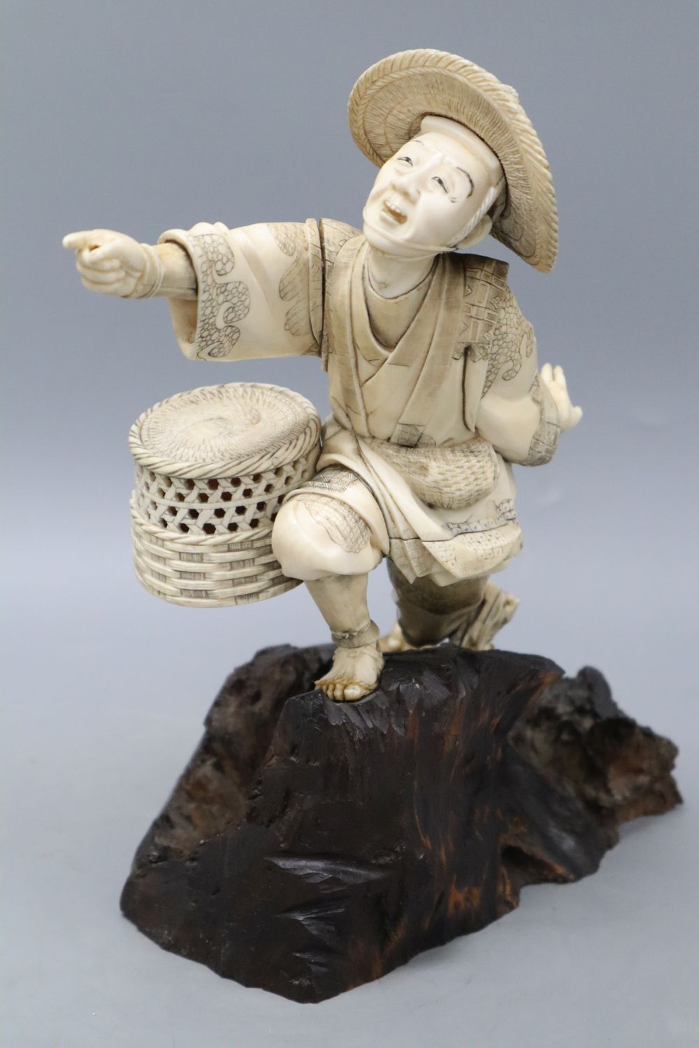 A Japanese Meiji ivory figure of a fisherman, height 26cm